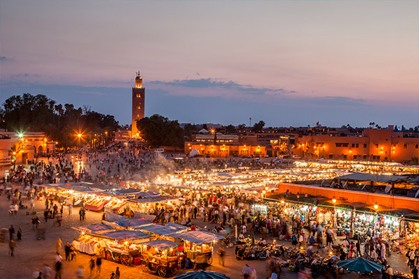 Marrakesh square at night with illuminated stalls