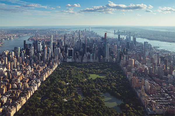 Aerial view of Central Park surrounded by skyscrapers and other budilings