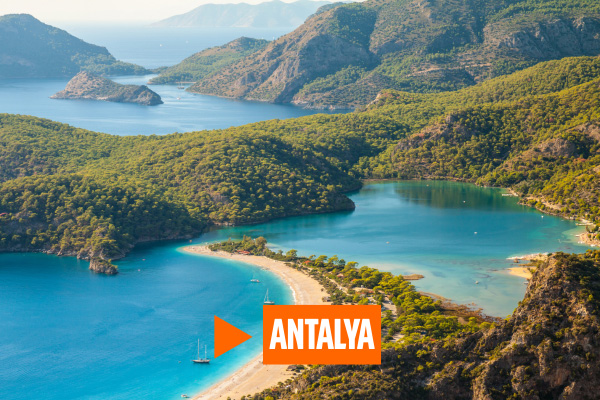 Aerial view of green-covered mountains and bay in Antalya