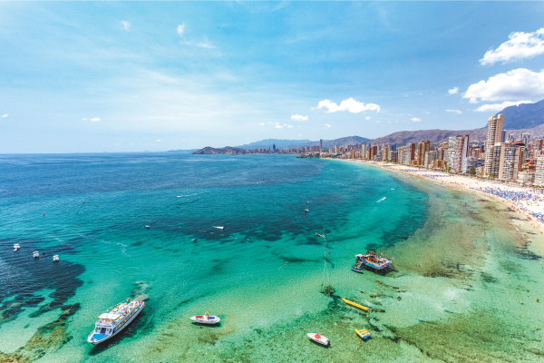 City skyline with a beach and blue waters