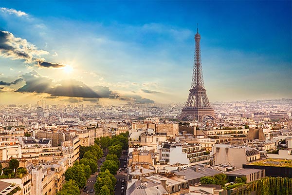 Eiffel Tower rising above surrounding buildings