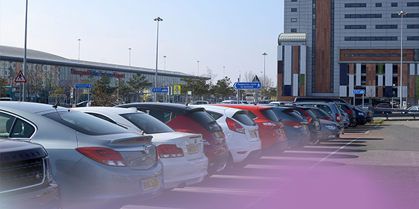 Car park with terminal in the background