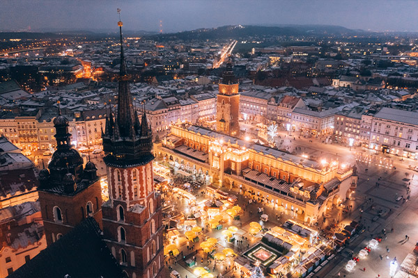 Aerial shot over Krakow's Main Square with Christmas markets in the middle