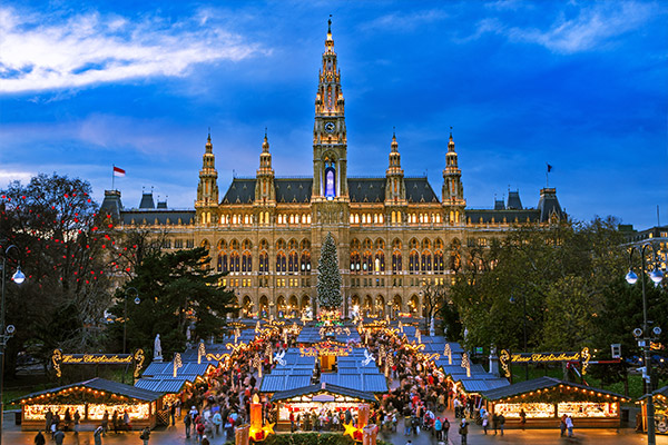 Town Hall of Vienna in the evening with Christmas market stalls in front of it