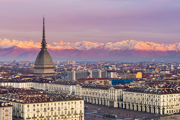 Cityscape of Turin to the backdr snow-covered mounains.