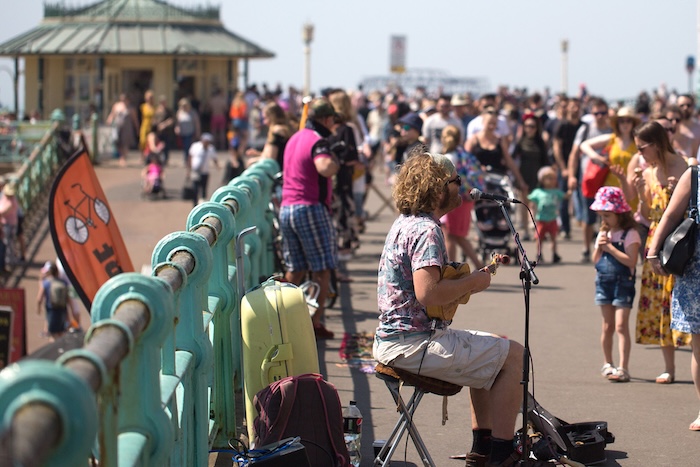 photo of Brighton seafront packed with people